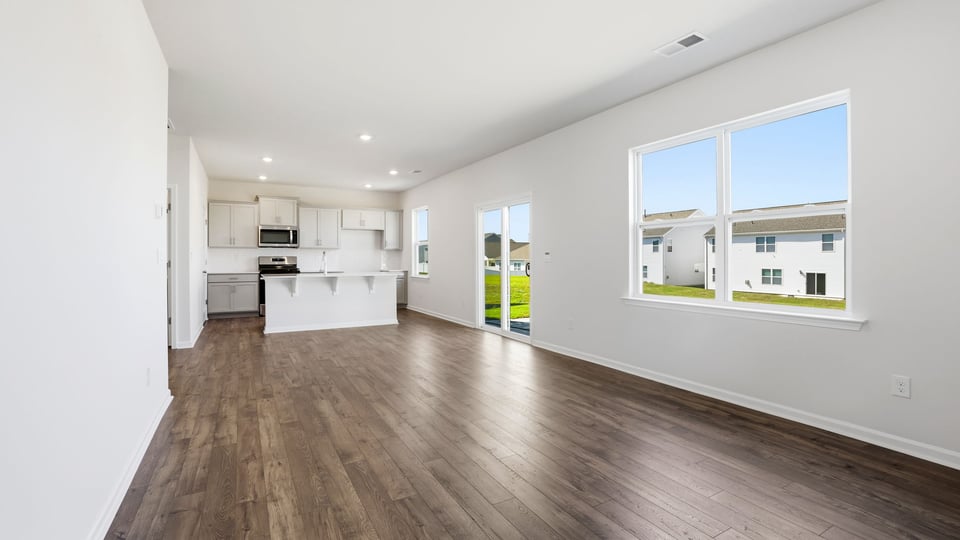 Family room with windows and fireplace.