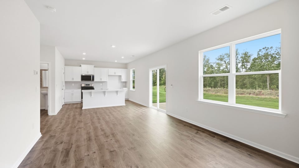 Living room with window and fireplace.