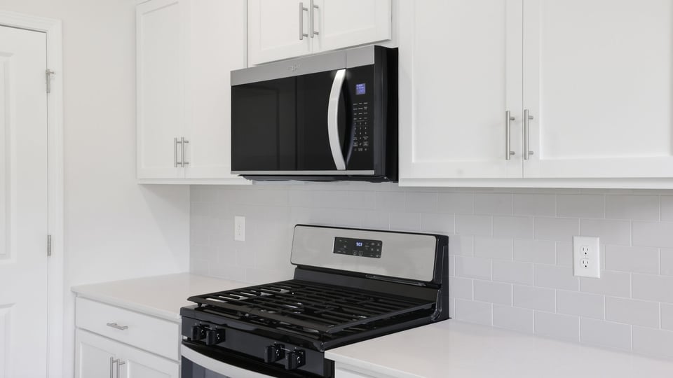 Kitchen with island and cabinets.