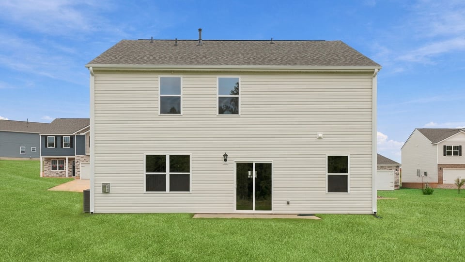 Back exterior with large backyard.
