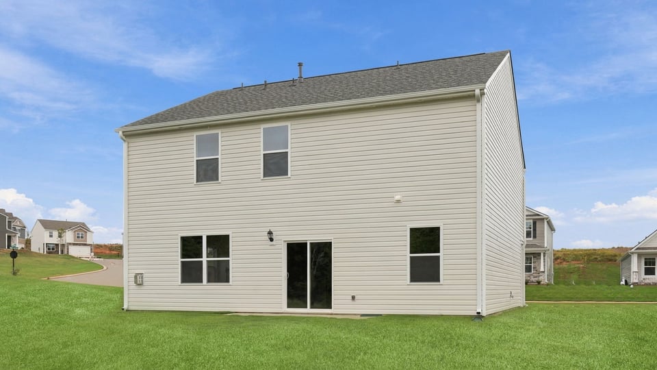 Back exterior with large backyard.