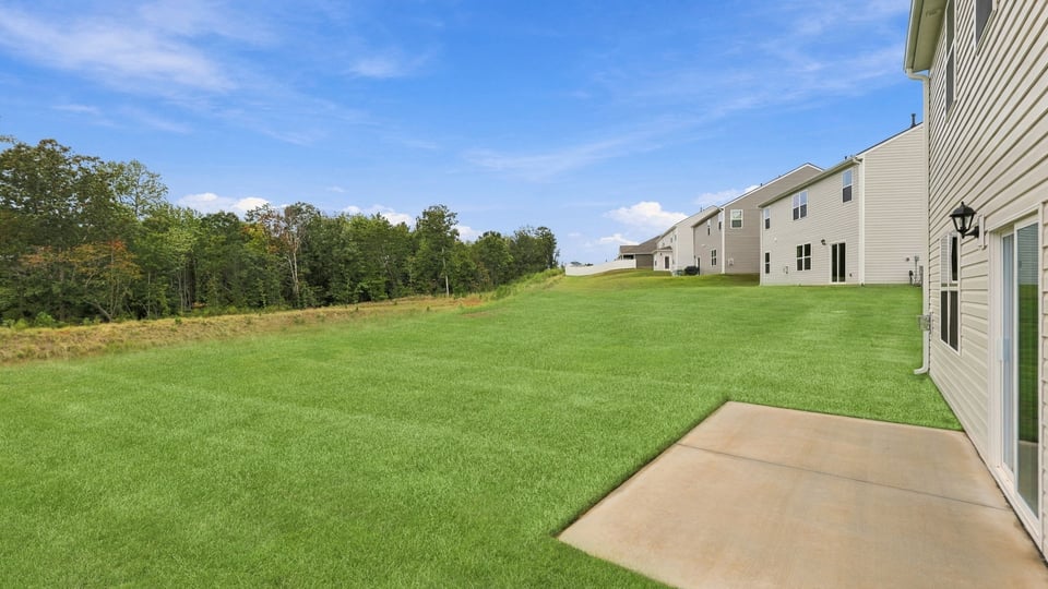 Back exterior with large backyard.