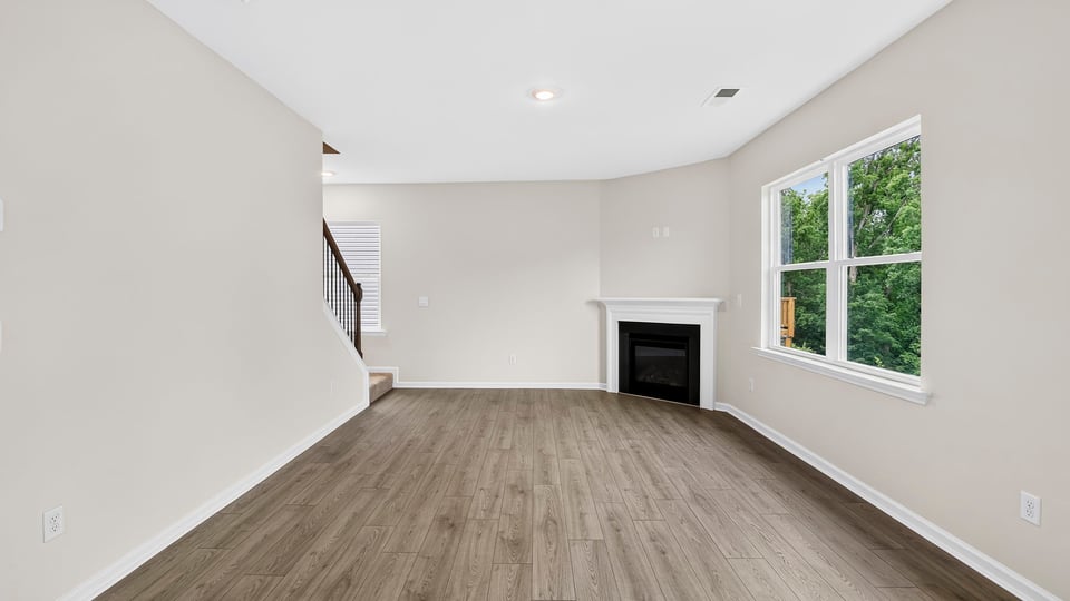 Family room with windows and fireplace.