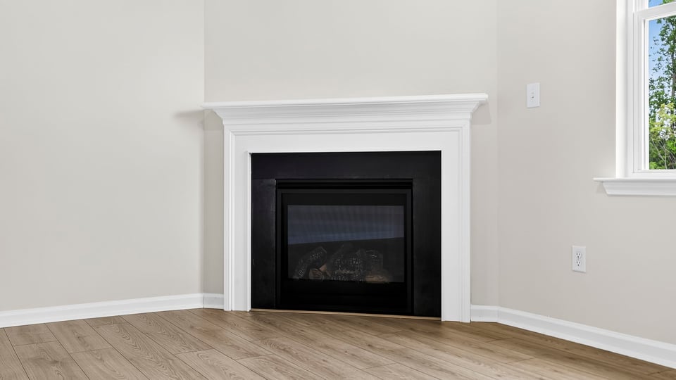 Family room with windows and fireplace.
