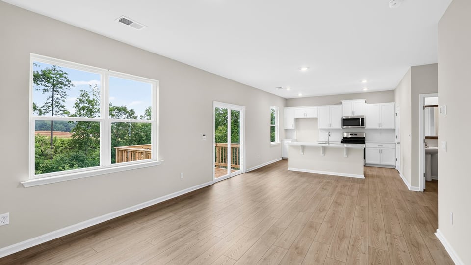 Family room with windows and fireplace.
