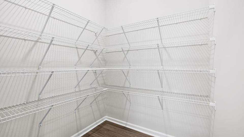 Closet with hanging storage racks.