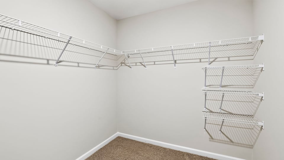 Closet with hanging storage racks.