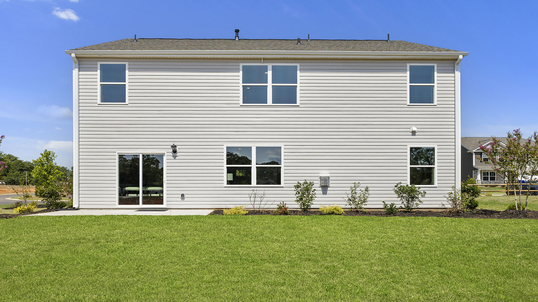 Back exterior with patio.