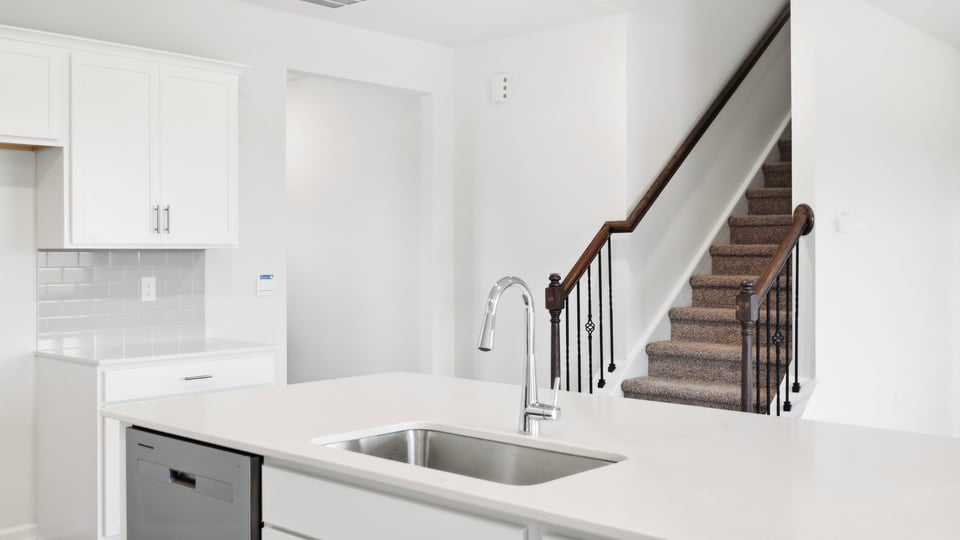 Kitchen with island and cabinets.