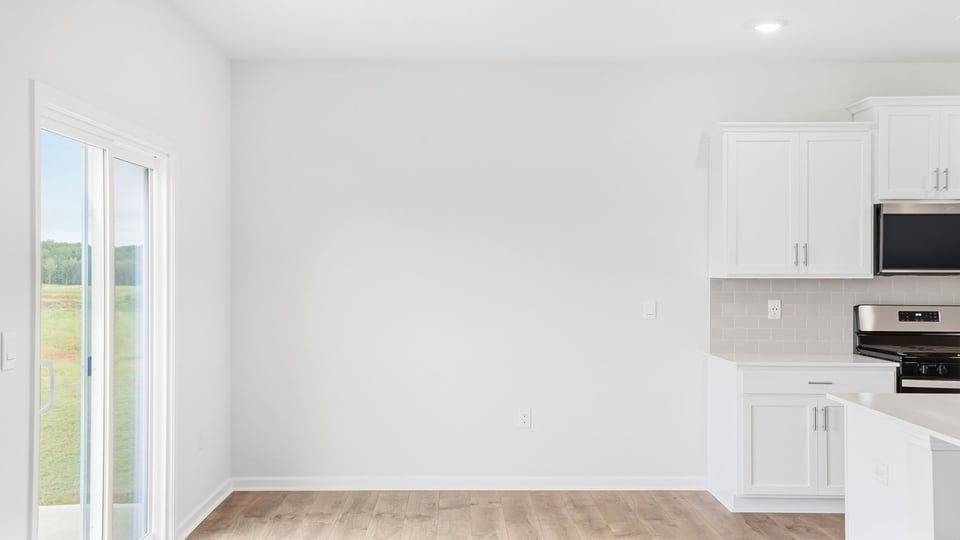 Kitchen with island and cabinets.