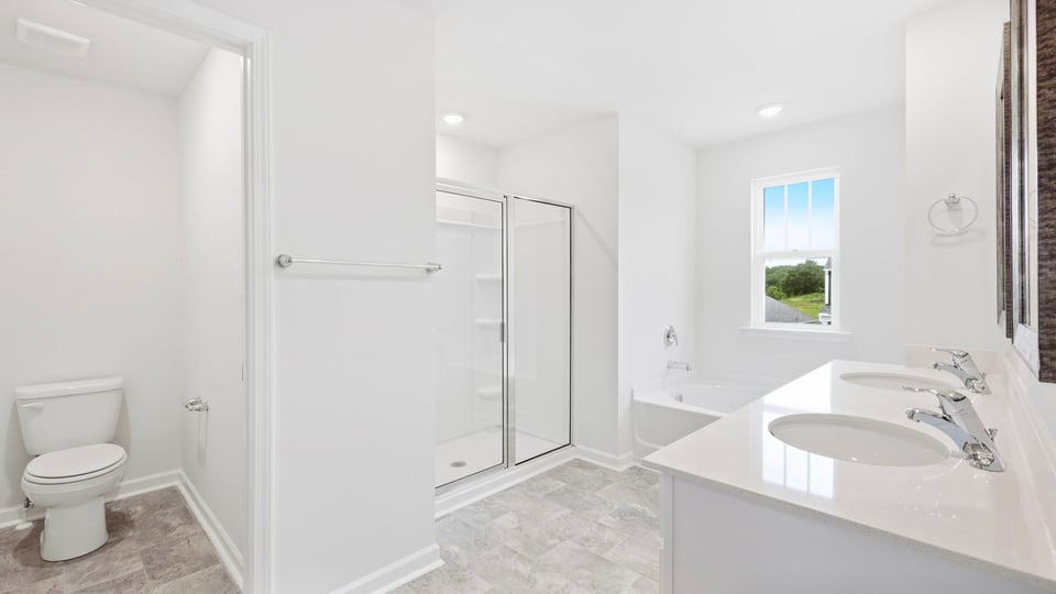 Primary bathroom with double vanity sinks.