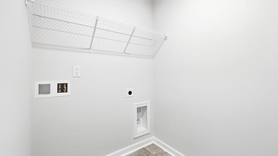 Laundry room with shelf.