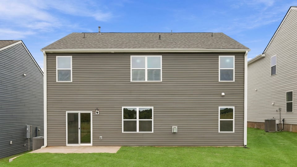 Back exterior with large backyard.