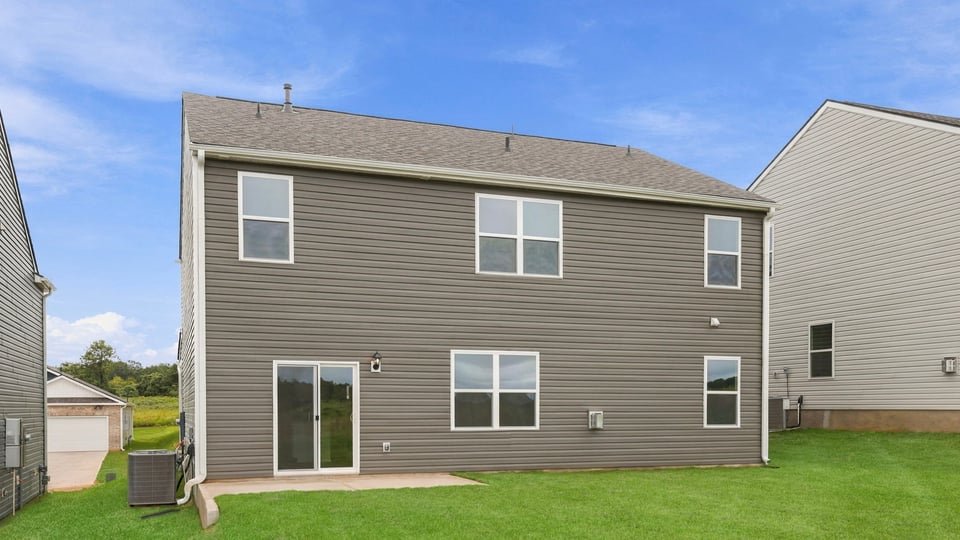 Back exterior with large backyard.