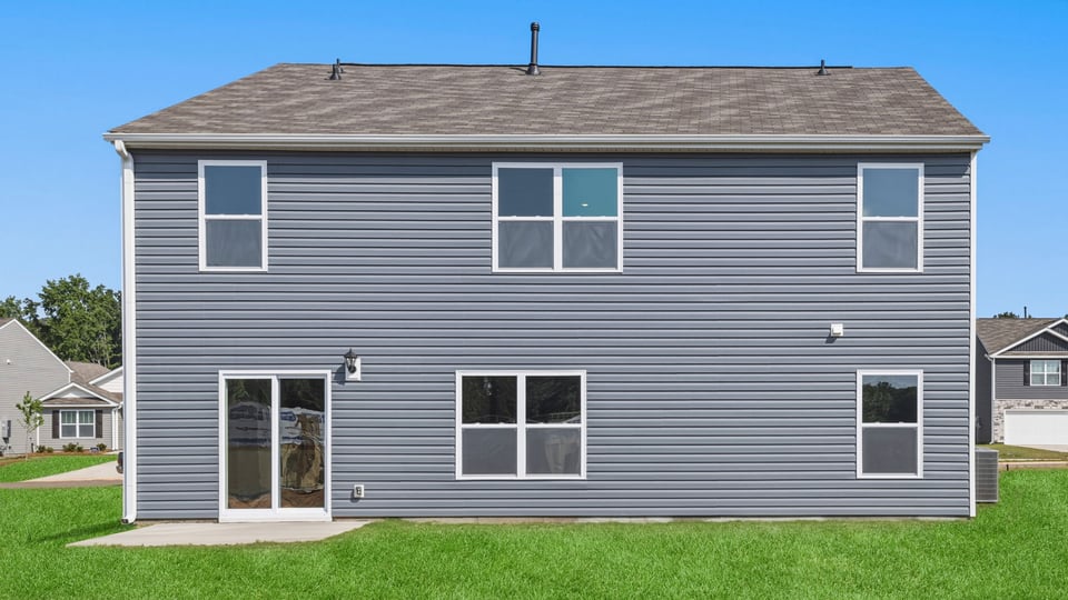 Back exterior with large backyard.