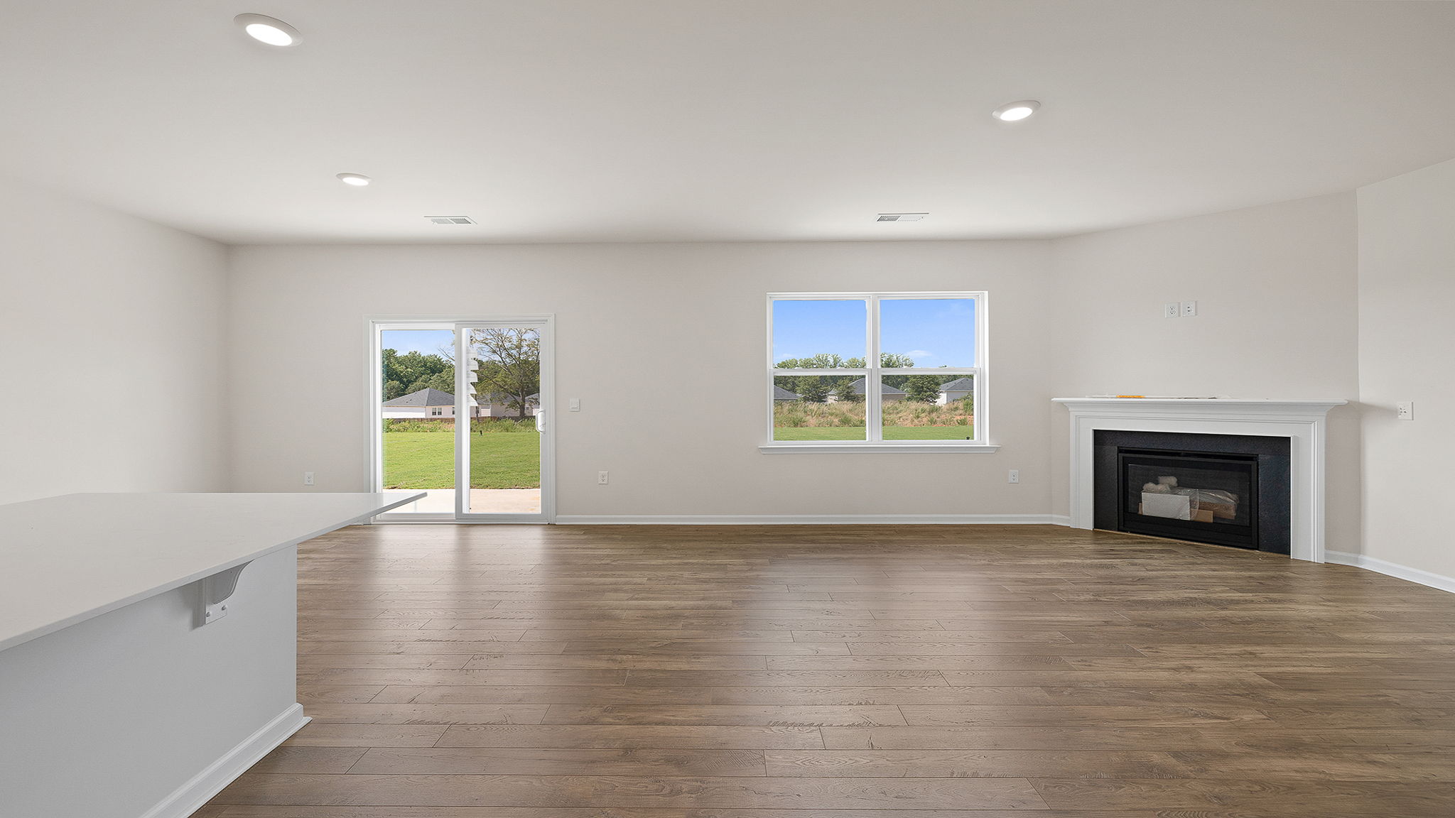Family room with fireplace and windows.