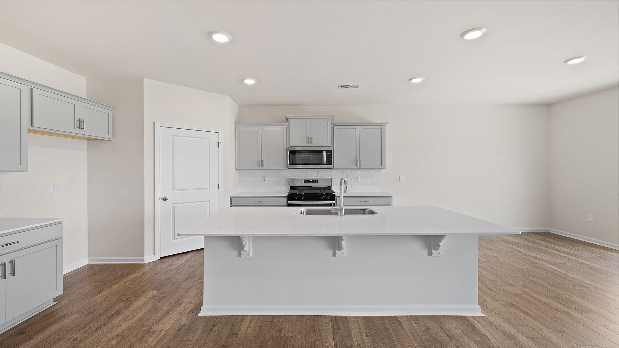 Family room with fireplace and windows.