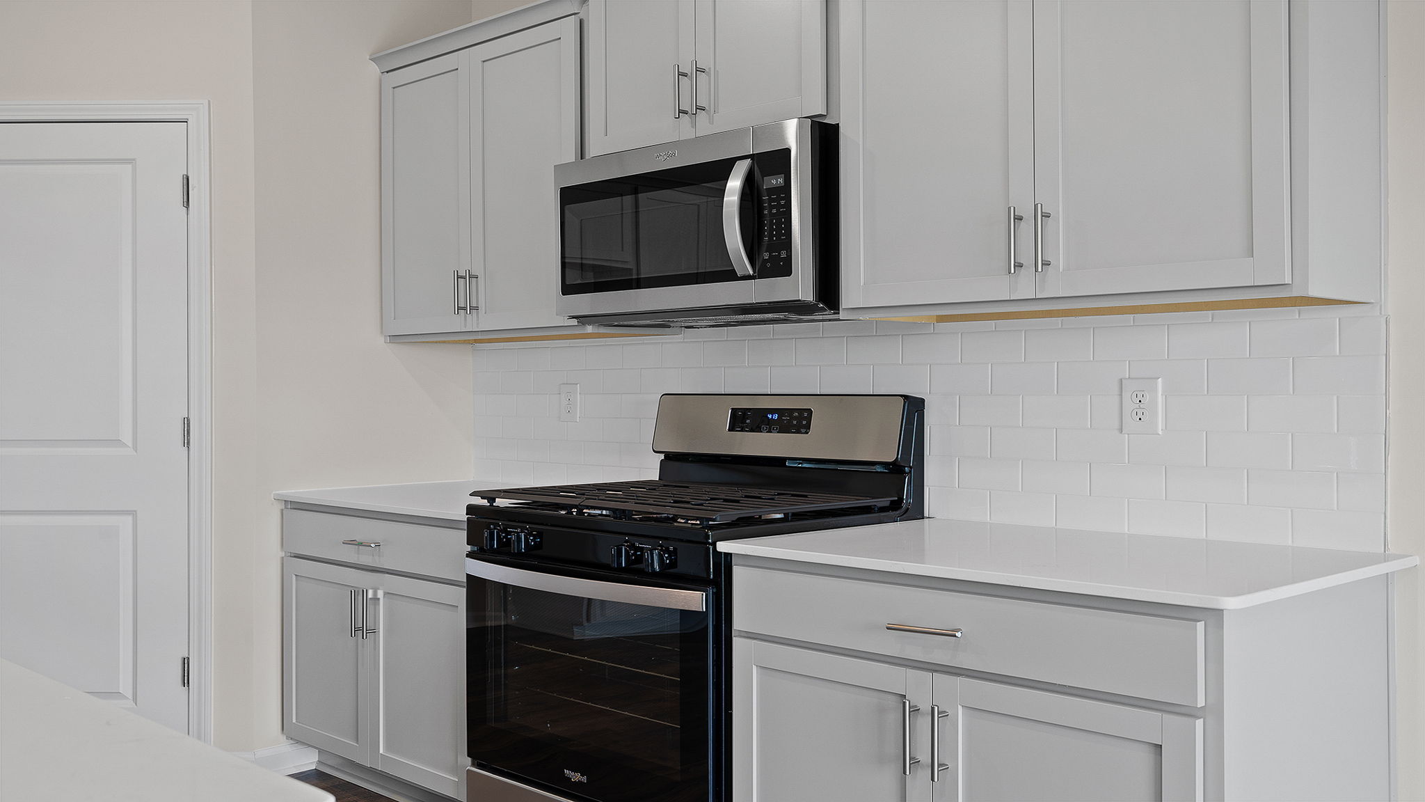Kitchen with granite counter tops and stainless steel appliances.