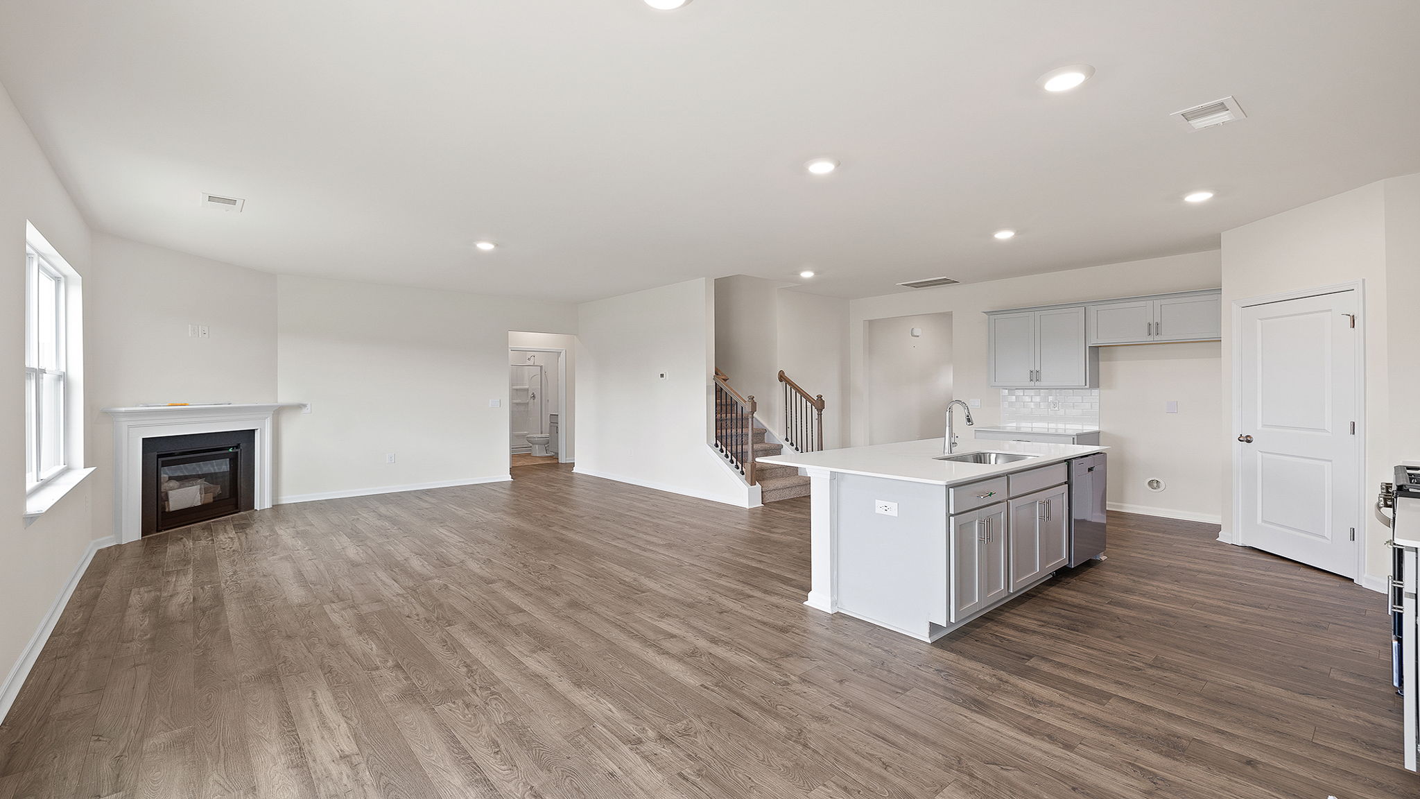 Kitchen with granite counter tops and stainless steel appliances.