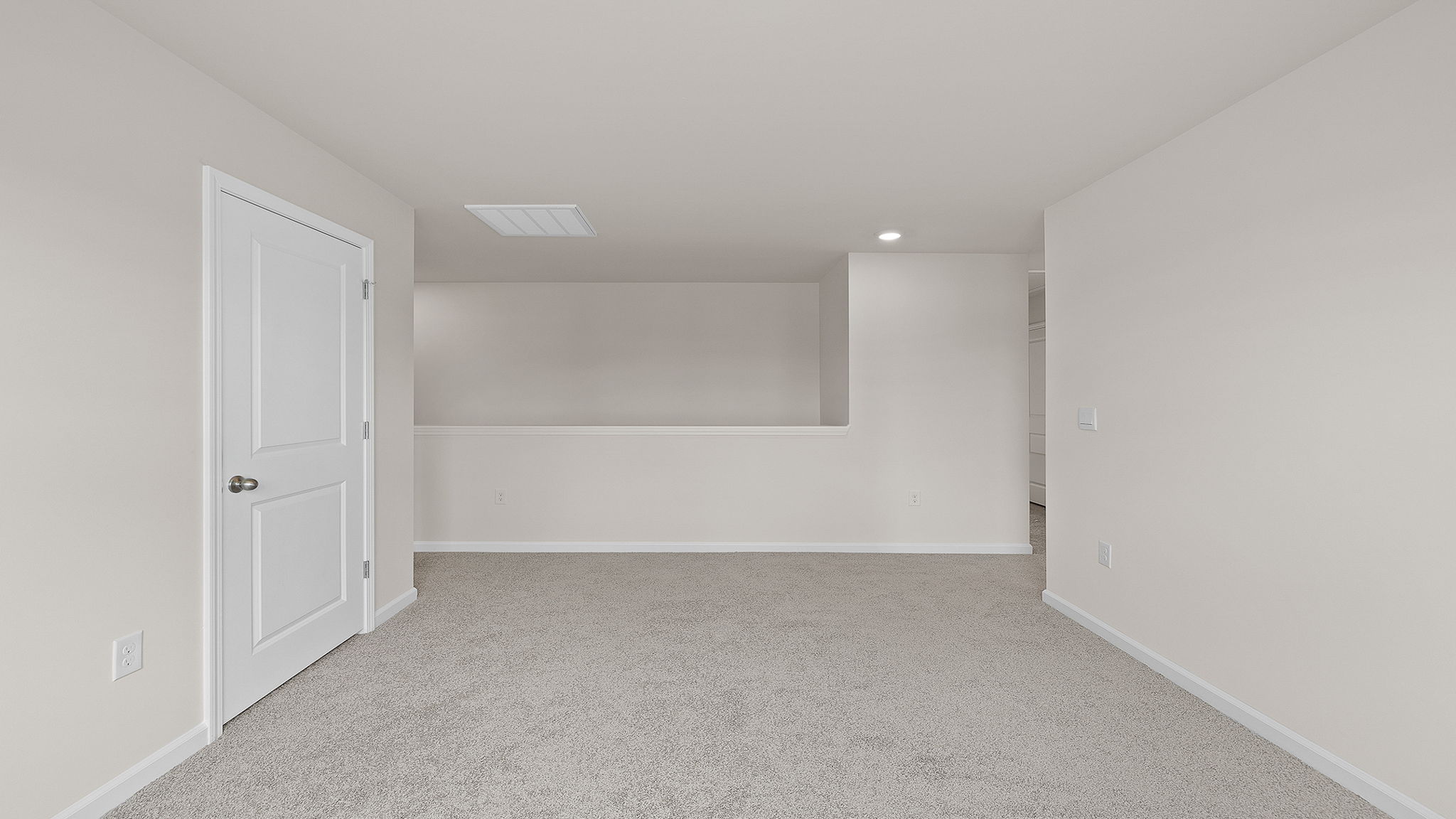 Upstairs area with carpet.