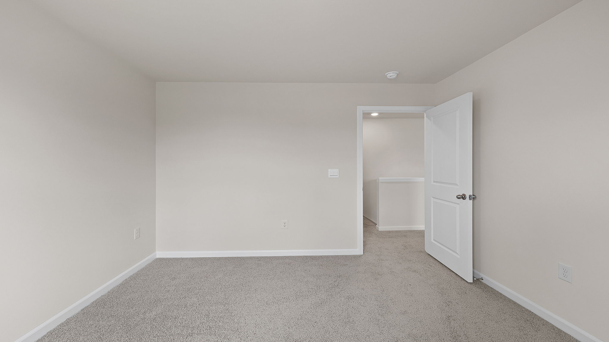 Upstairs area with carpet.