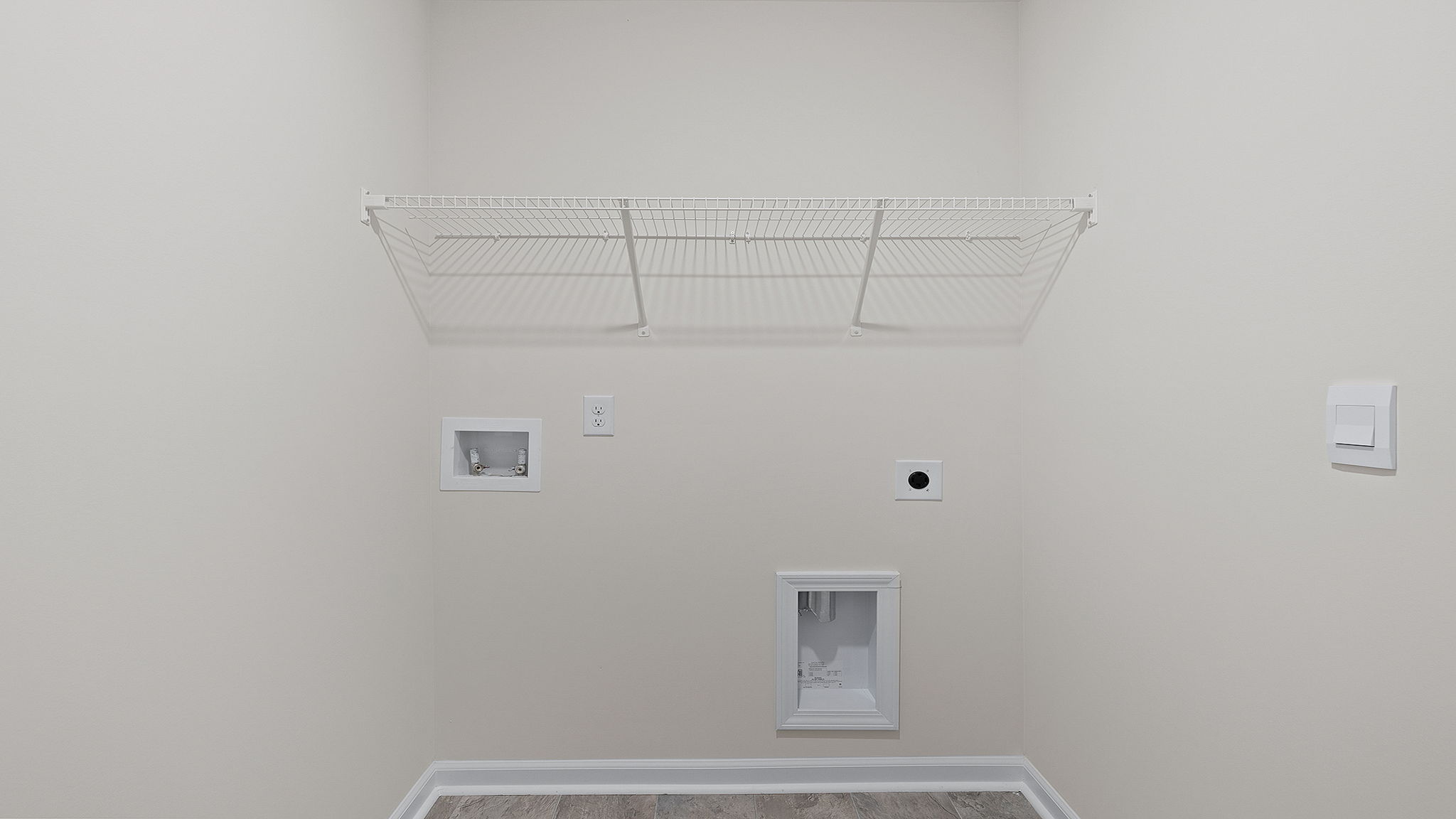 Laundry closet with hanging storage racks.