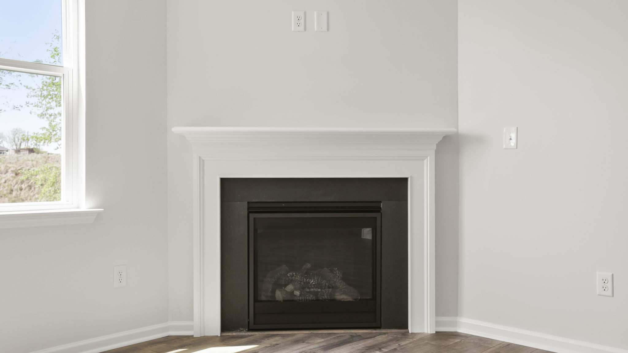 Family room with windows and fireplace.
