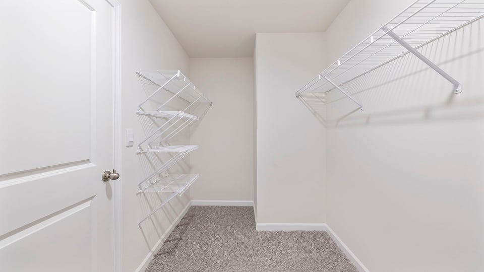Closet with hanging storage racks.