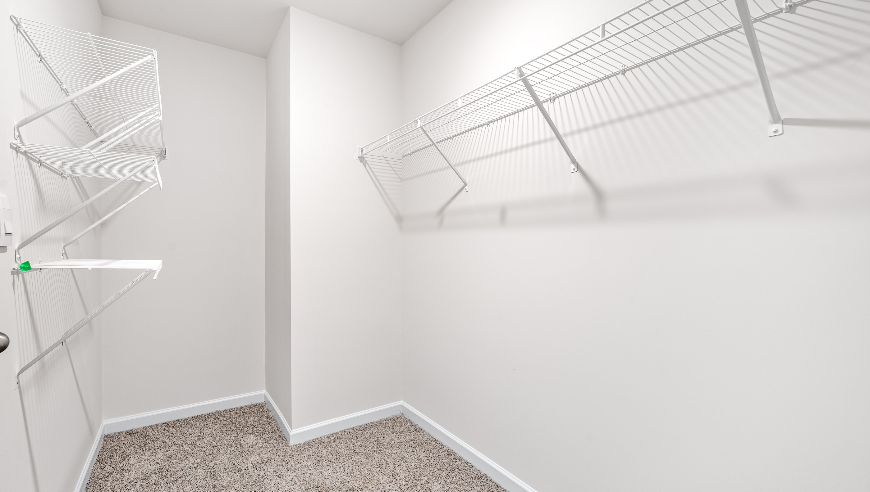 Primary bedroom walk-in closet.