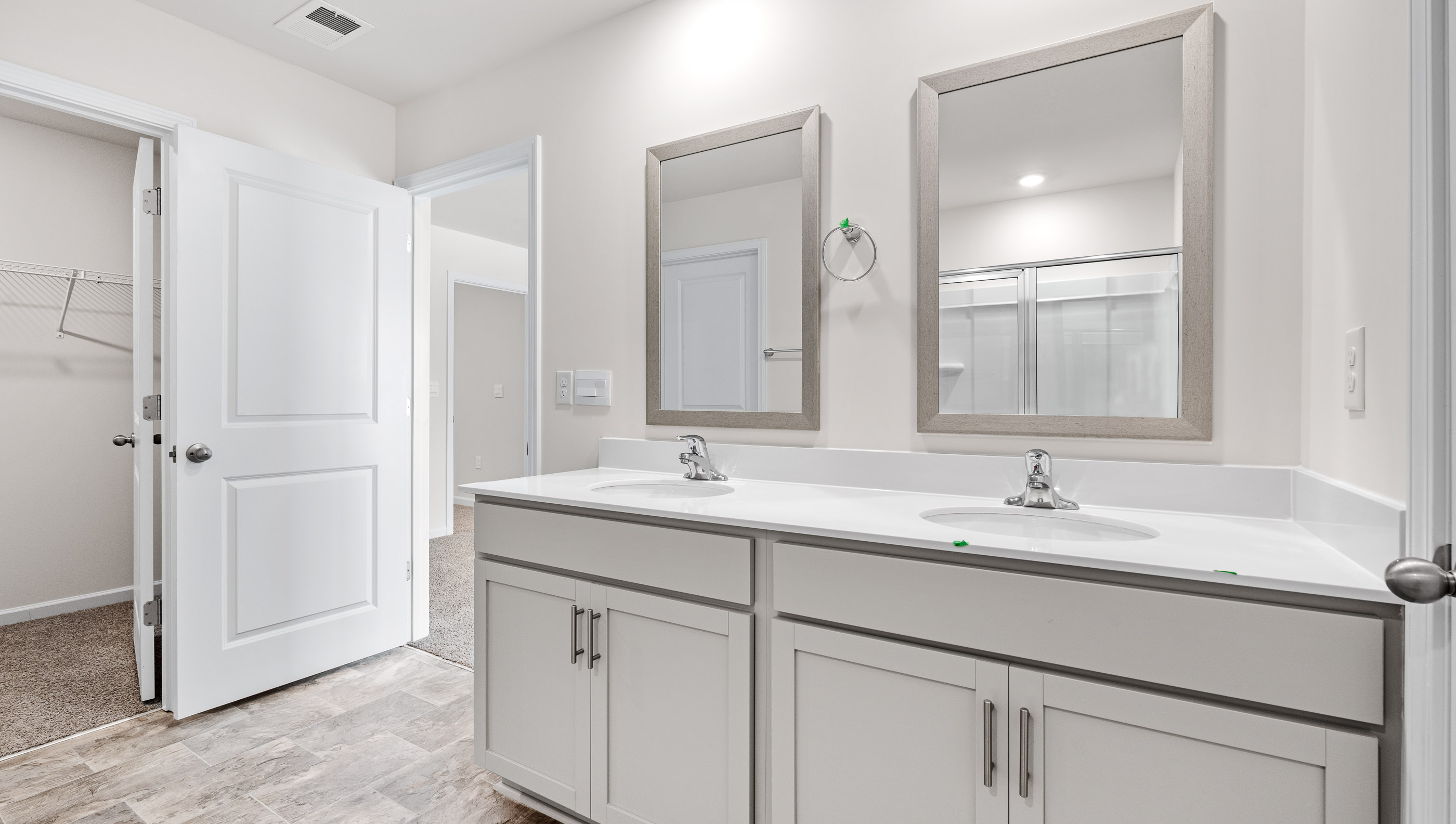 Primary bathroom with dual sink vanity.