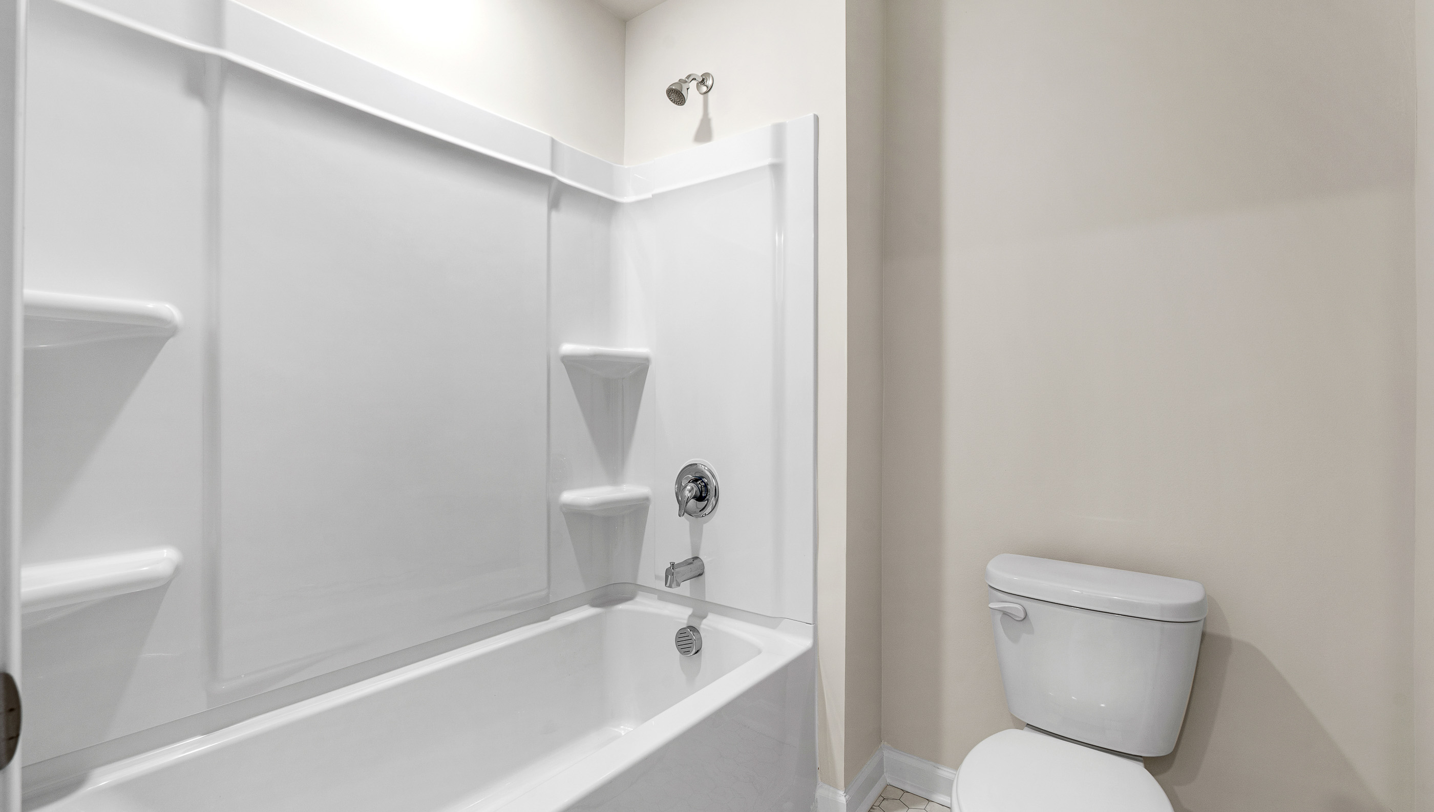 Bathroom with bathtub and toilet.