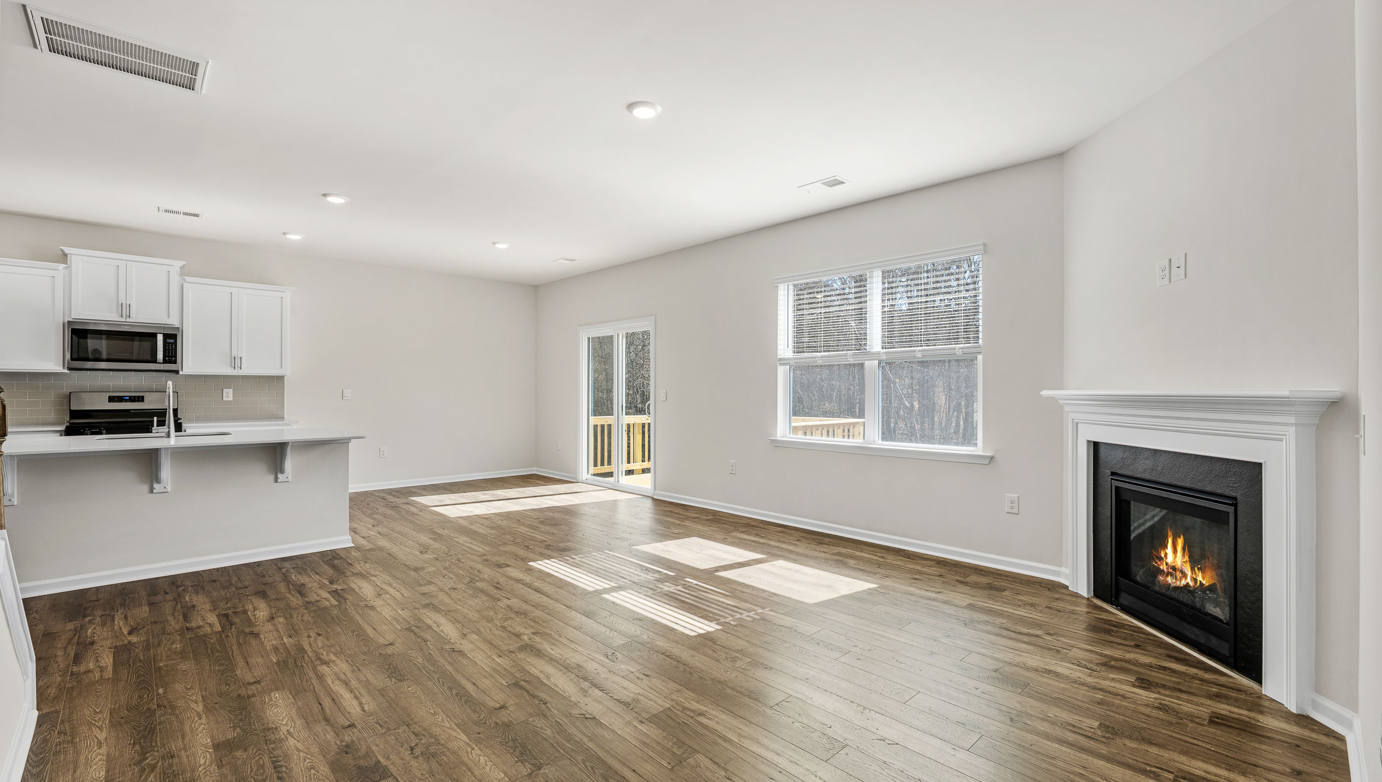Family room with window and fireplace.