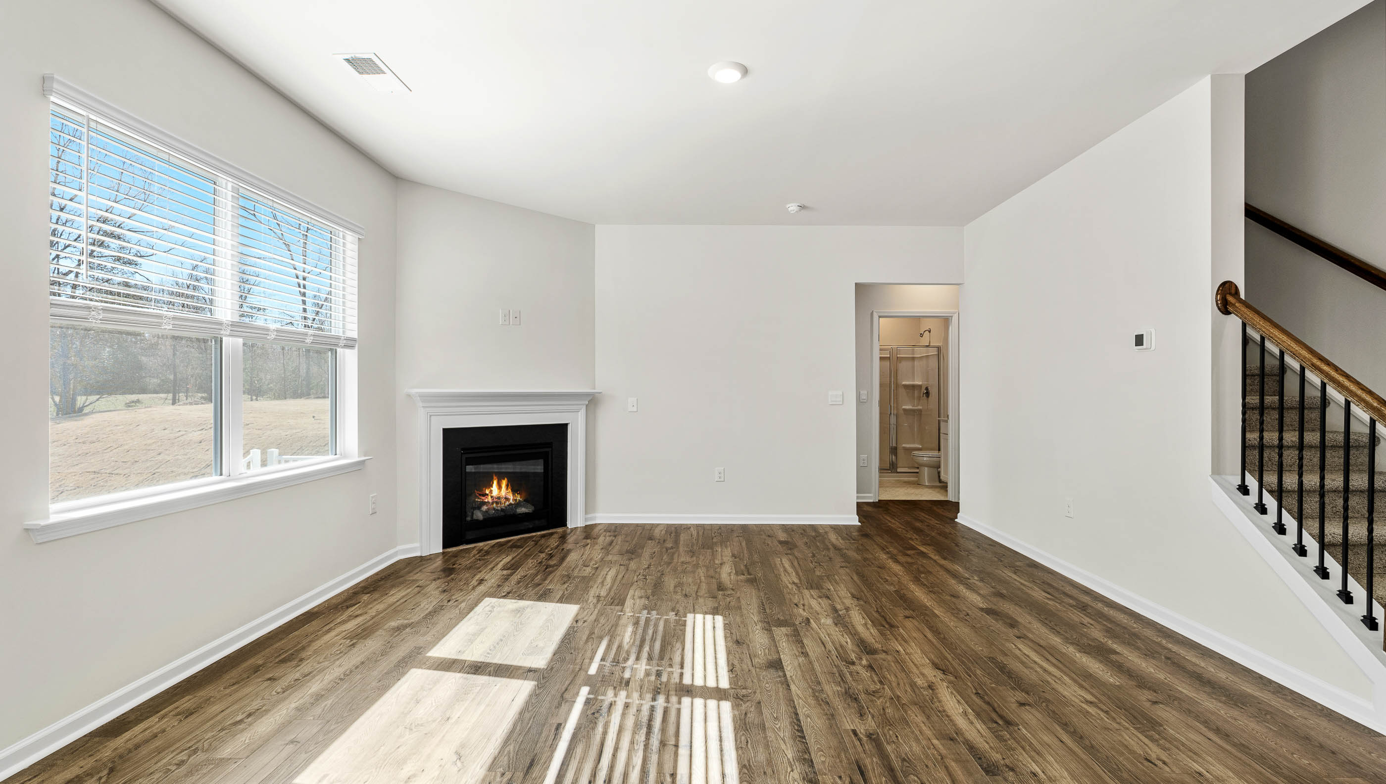 Family room with window and fireplace.