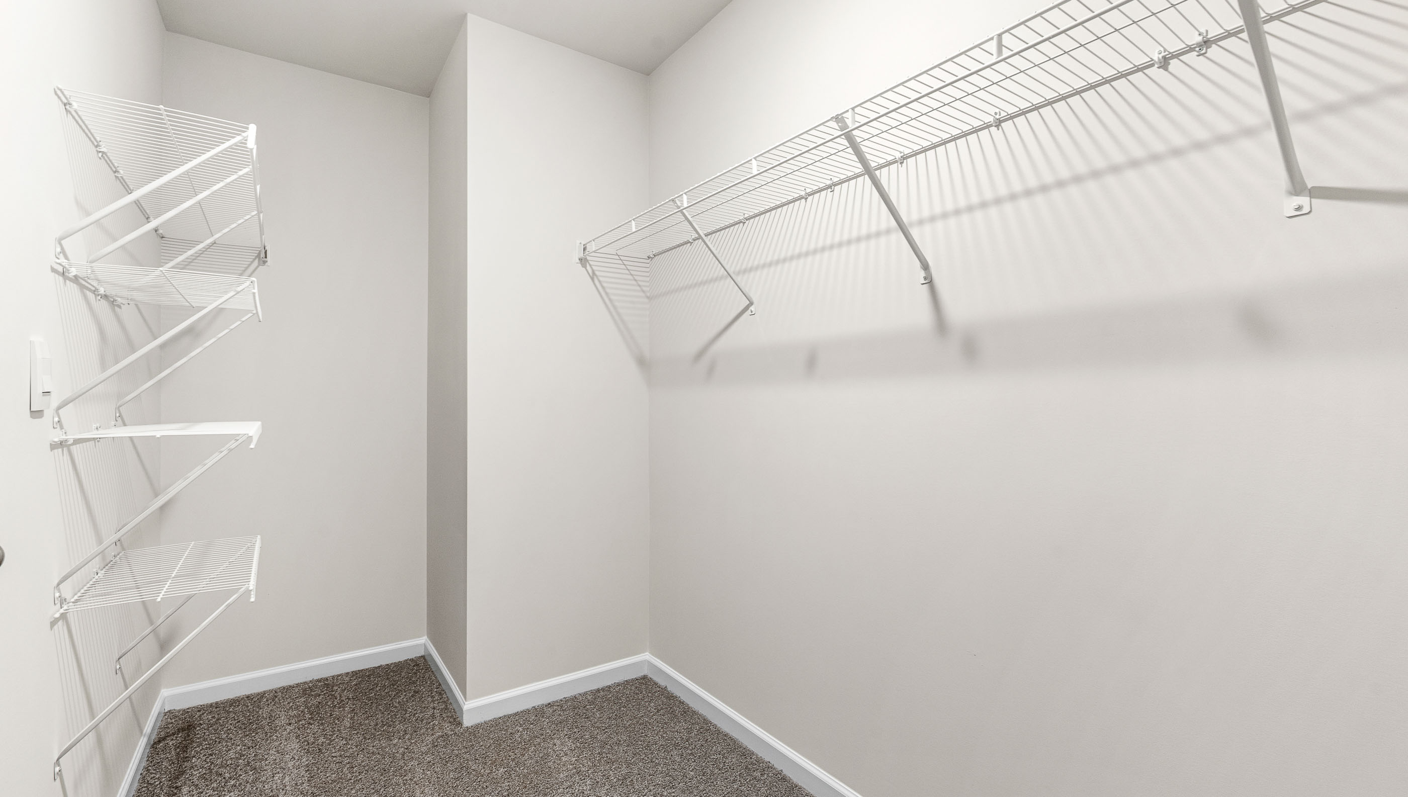 Closet with hanging storage racks.