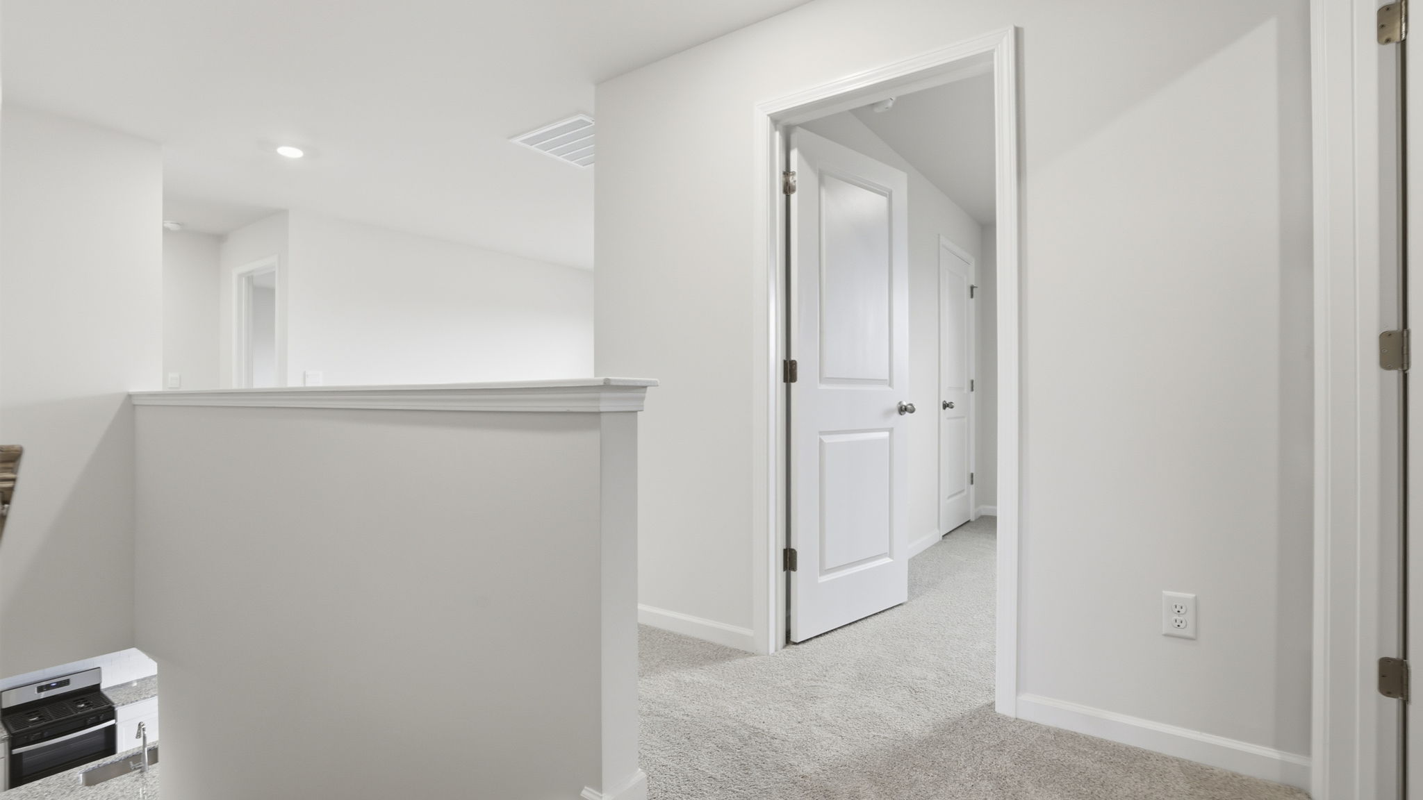 Upper level landing and view of hallway.