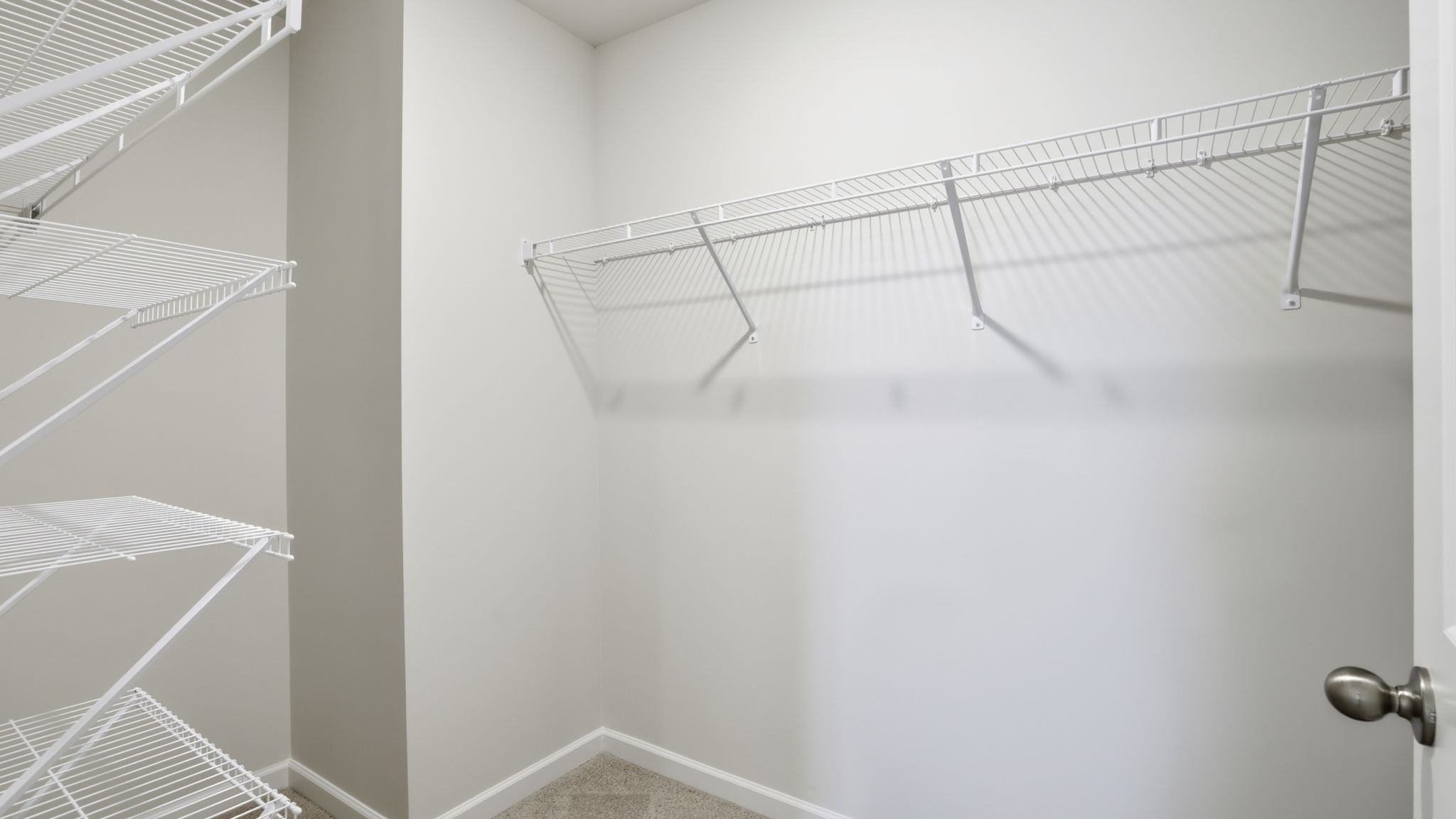 Primary bedroom walk-in closet.