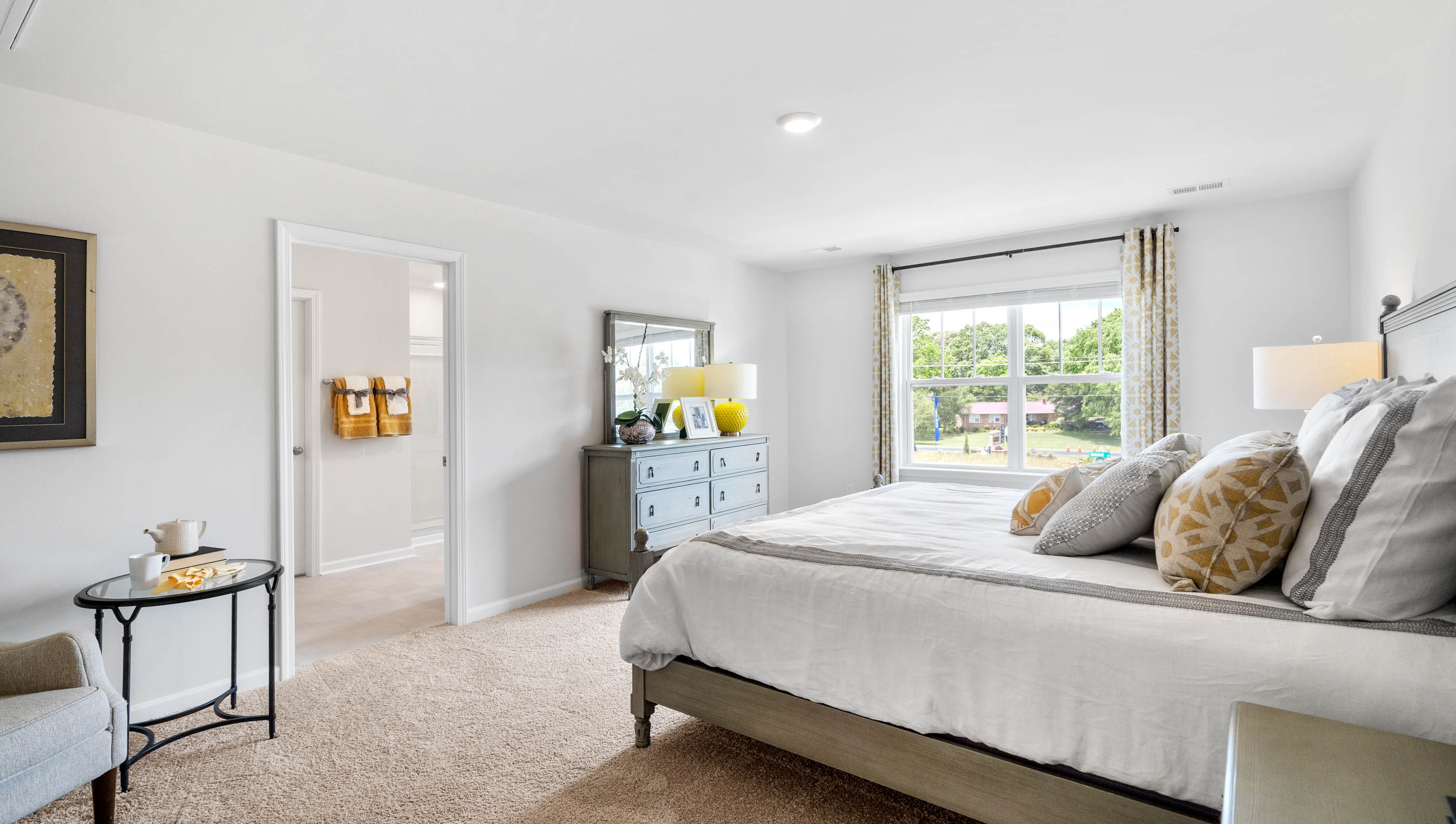 Bedroom with carpet and window.