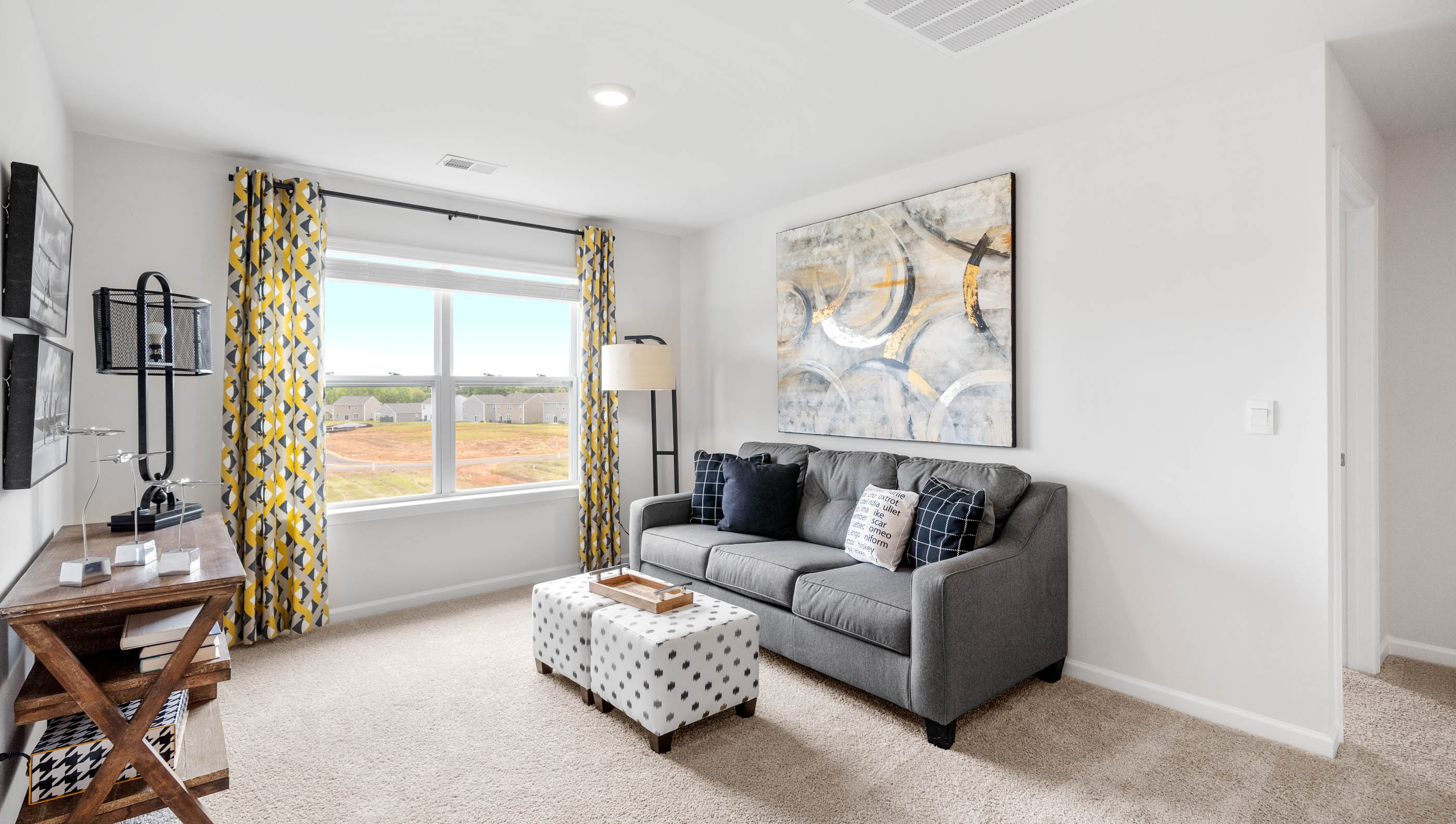 Bedroom with carpet and window.