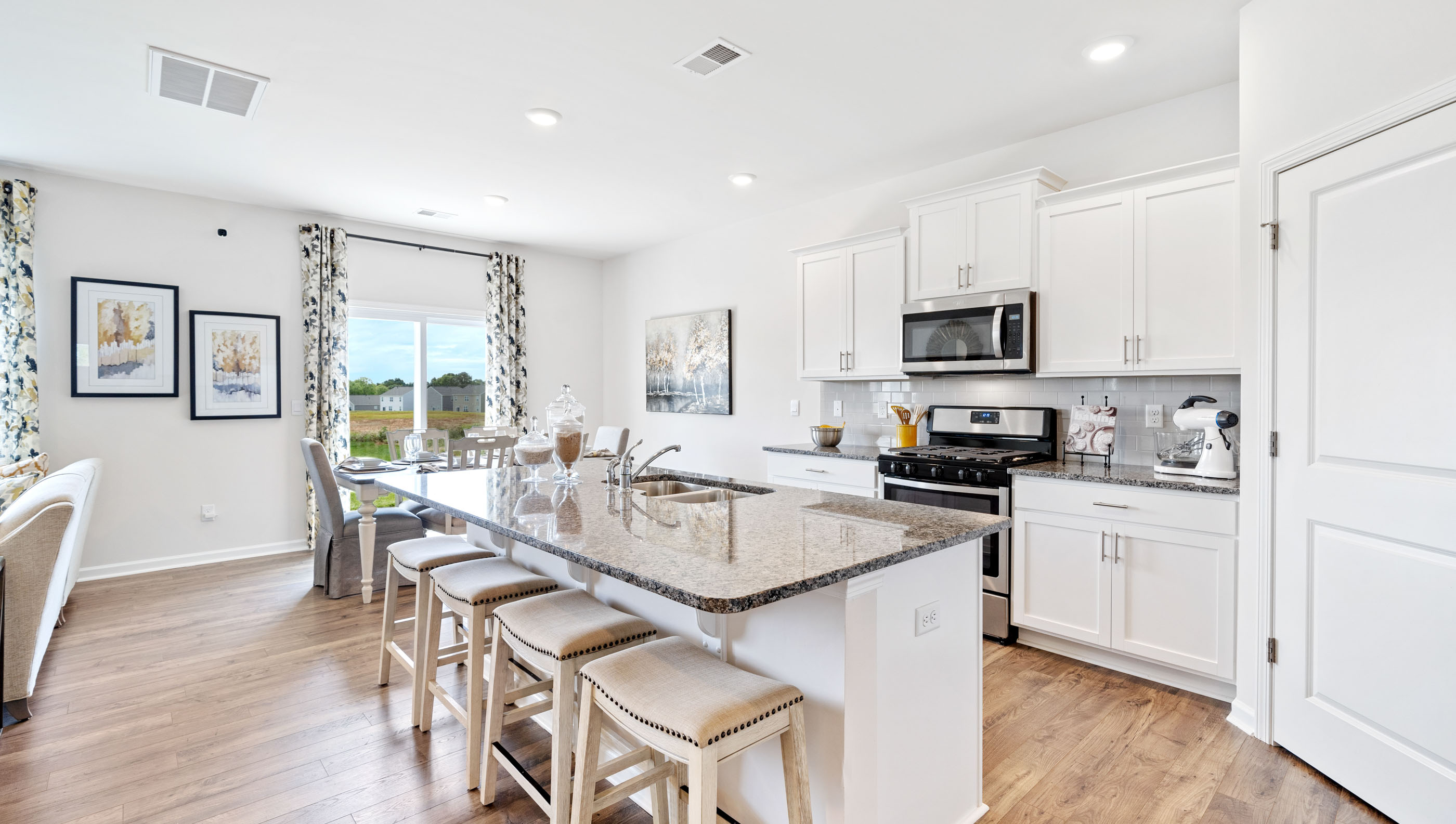 Kitchen and island with granite counter tops.