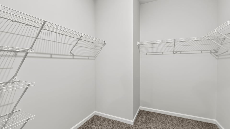 Closet with hanging storage racks.