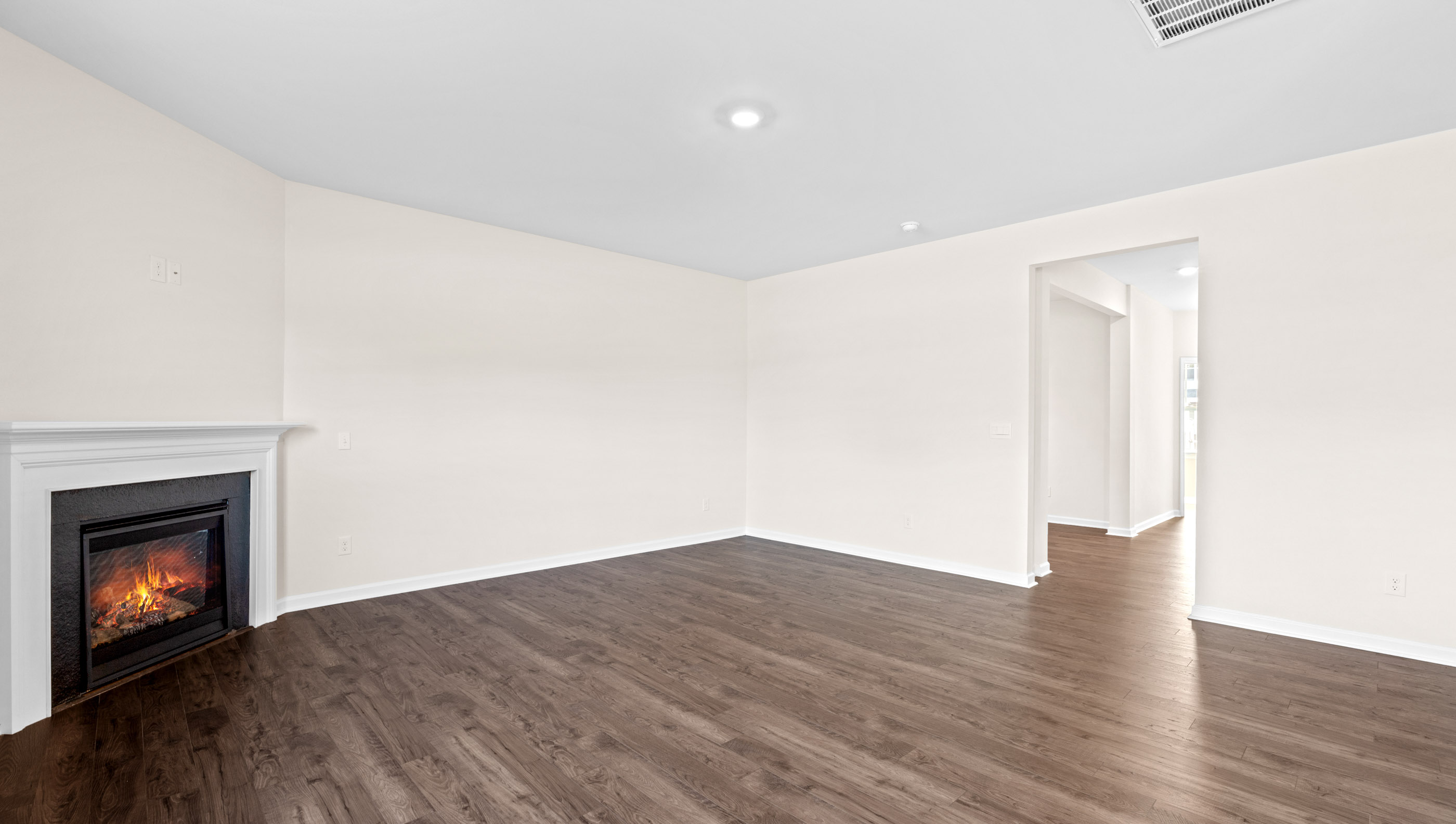 Family room with windows and fireplace.