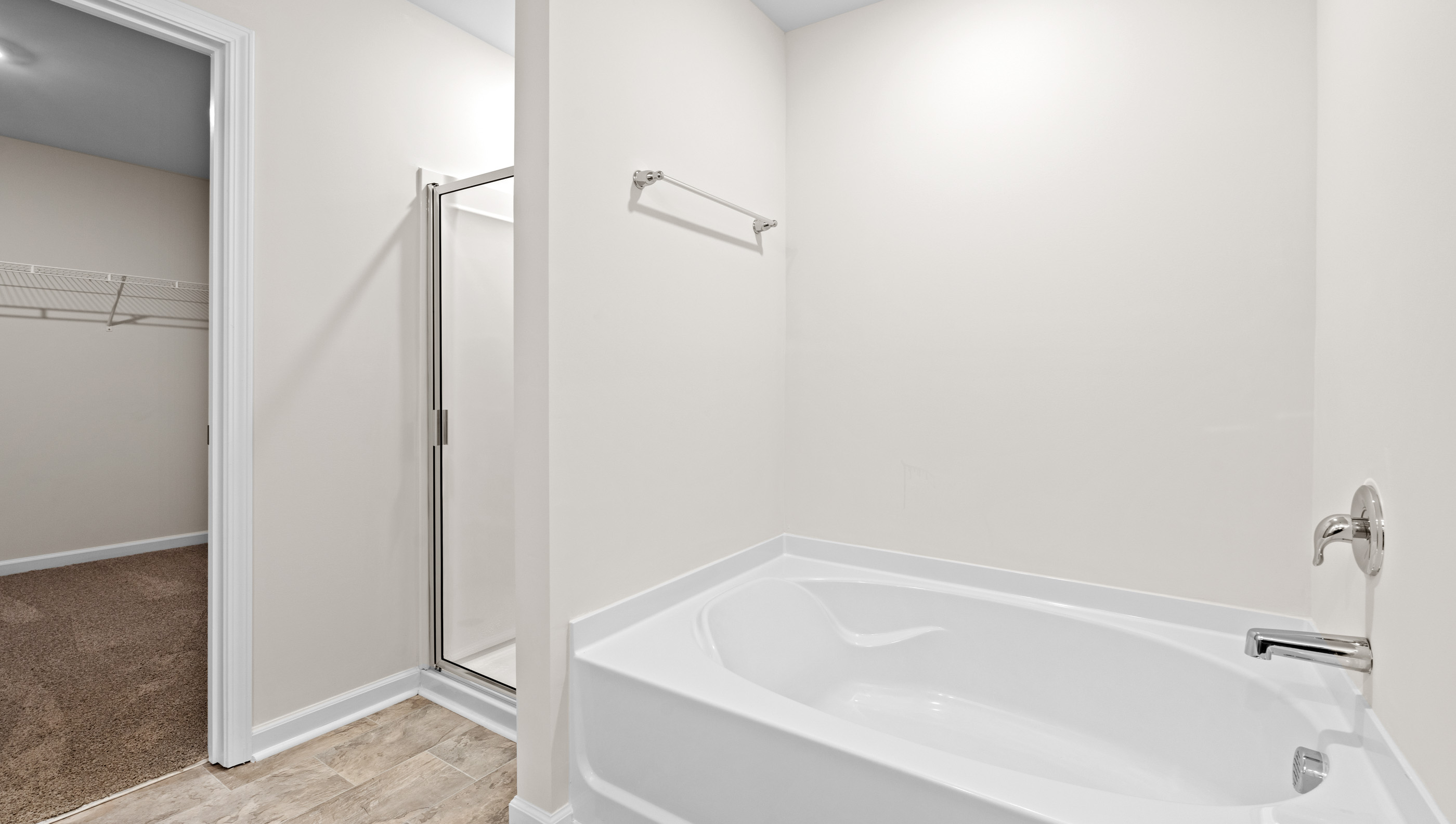 Bathroom with tub and closet.
