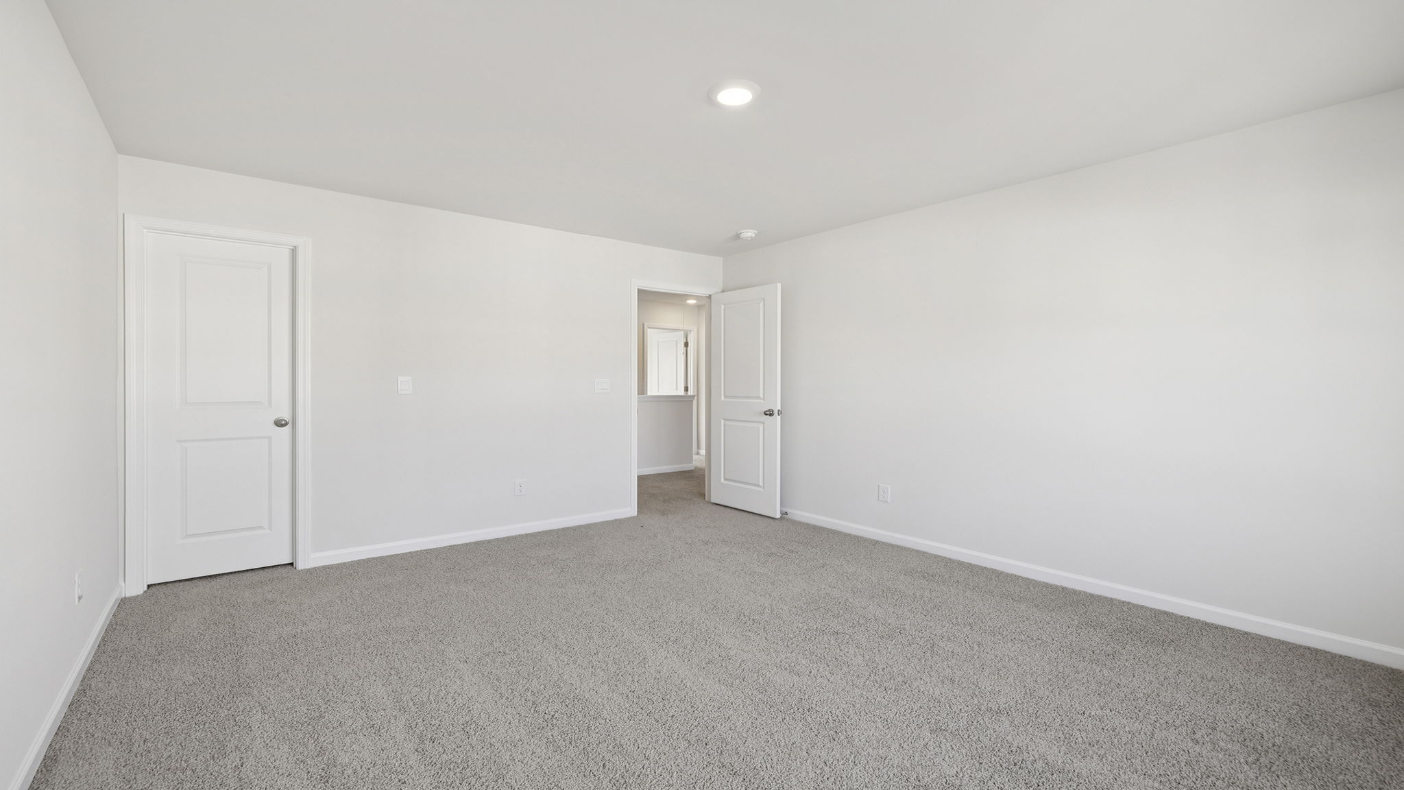Bedroom with carpet.