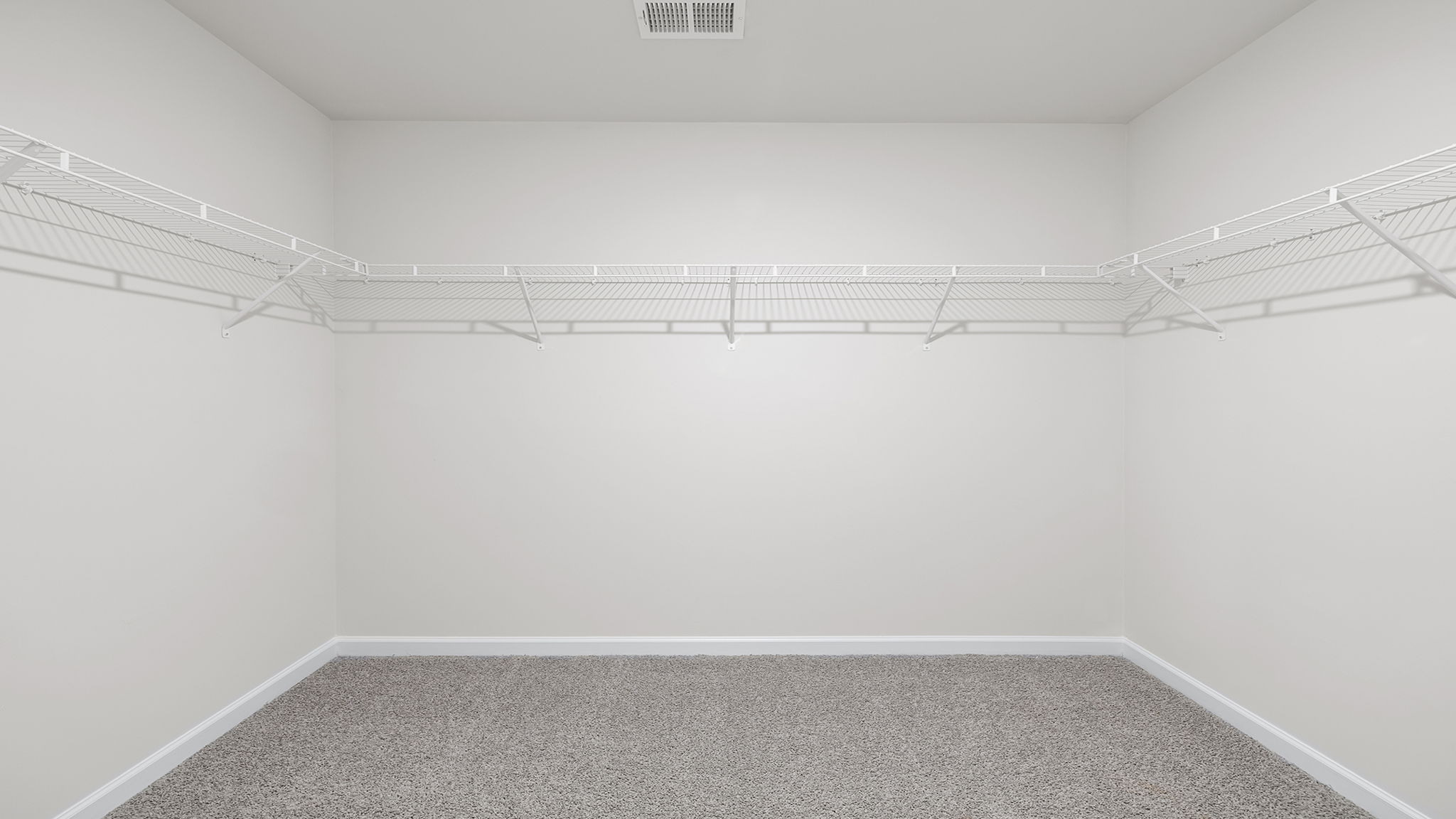 Primary bedroom walk-in closet.