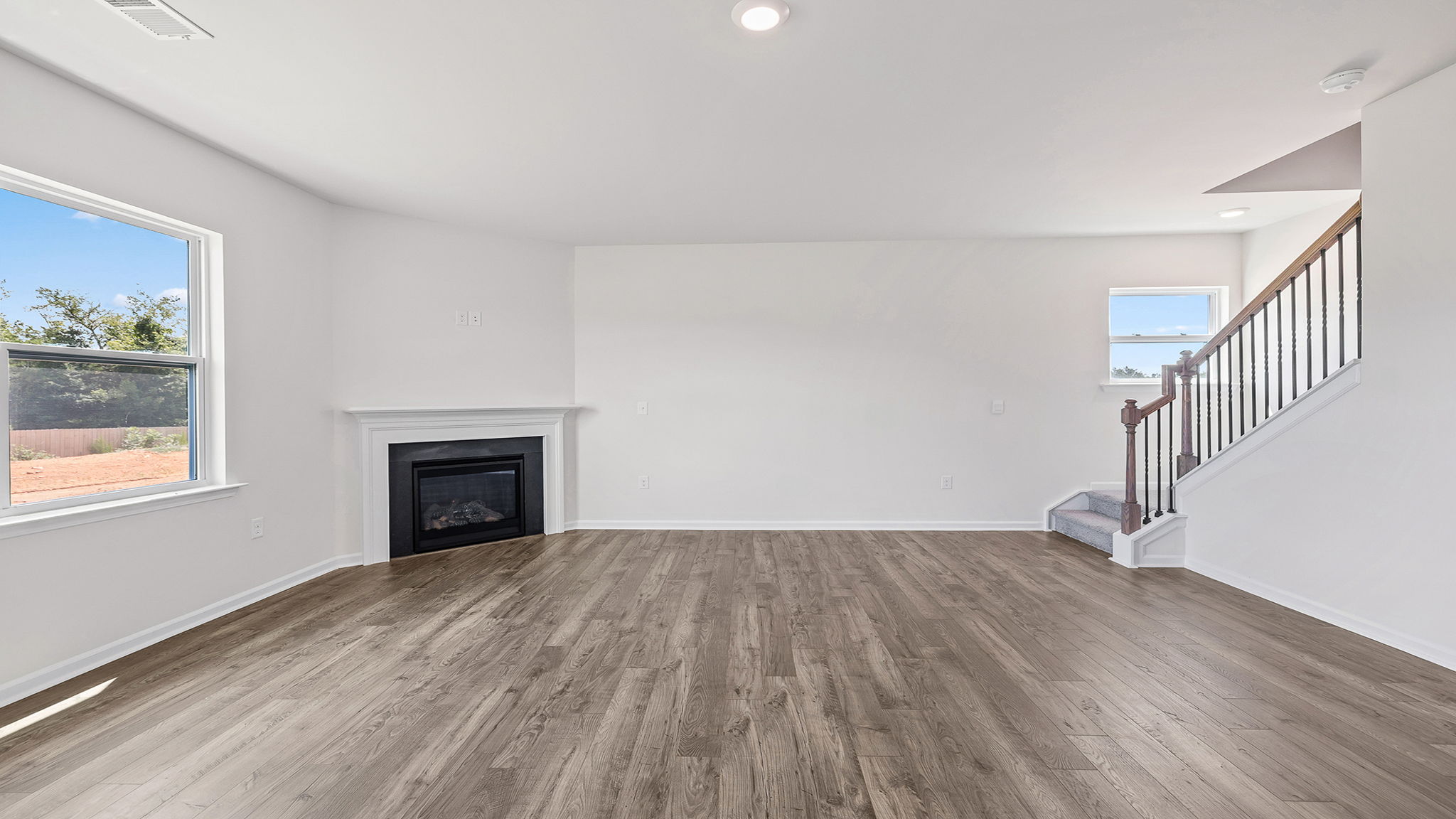 Family room with windows and fireplace.