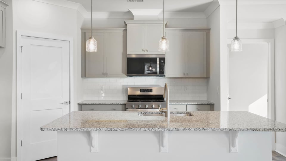 Kitchen with island and cabinets.