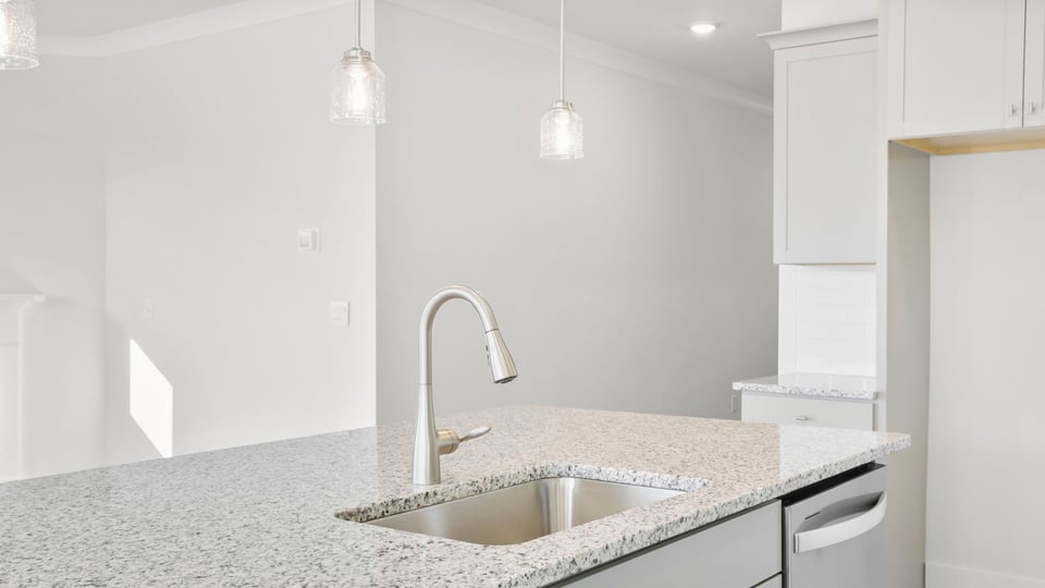 Kitchen with island and cabinets.