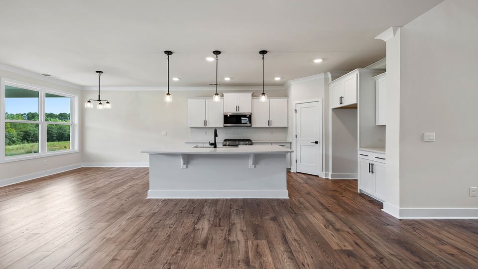 Kitchen with island and cabinets.