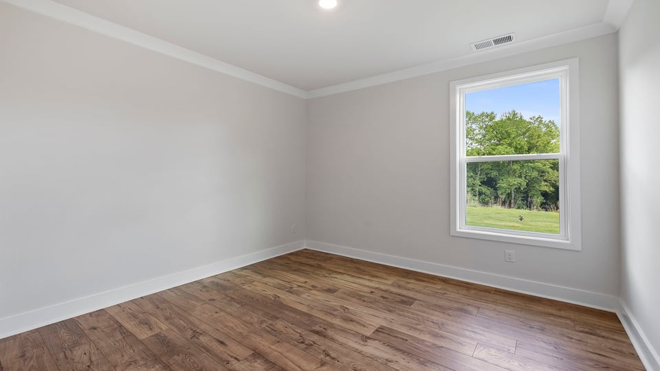 Bedroom with window and closet.