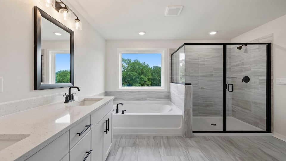 Primary bathroom with double vanity sinks.